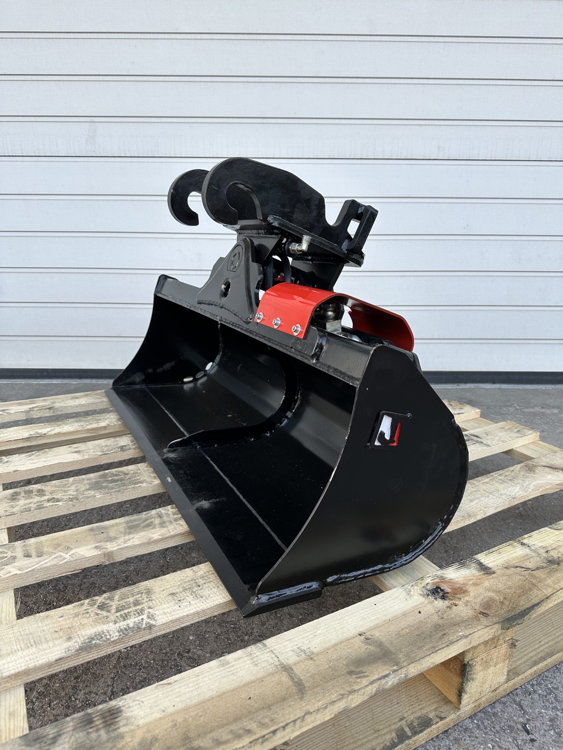 Godet de curage inclinable